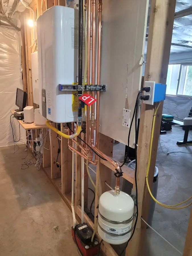 Licensed plumber repairing a kitchen sink in Smithfield