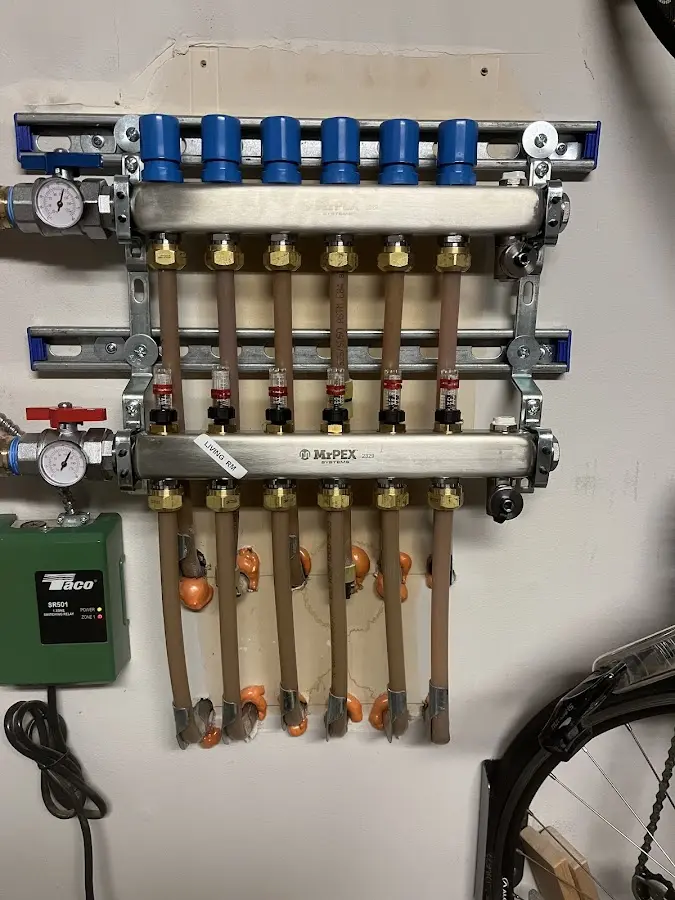 Plumber performing Water Heater Repair at a residential property in Smithfield